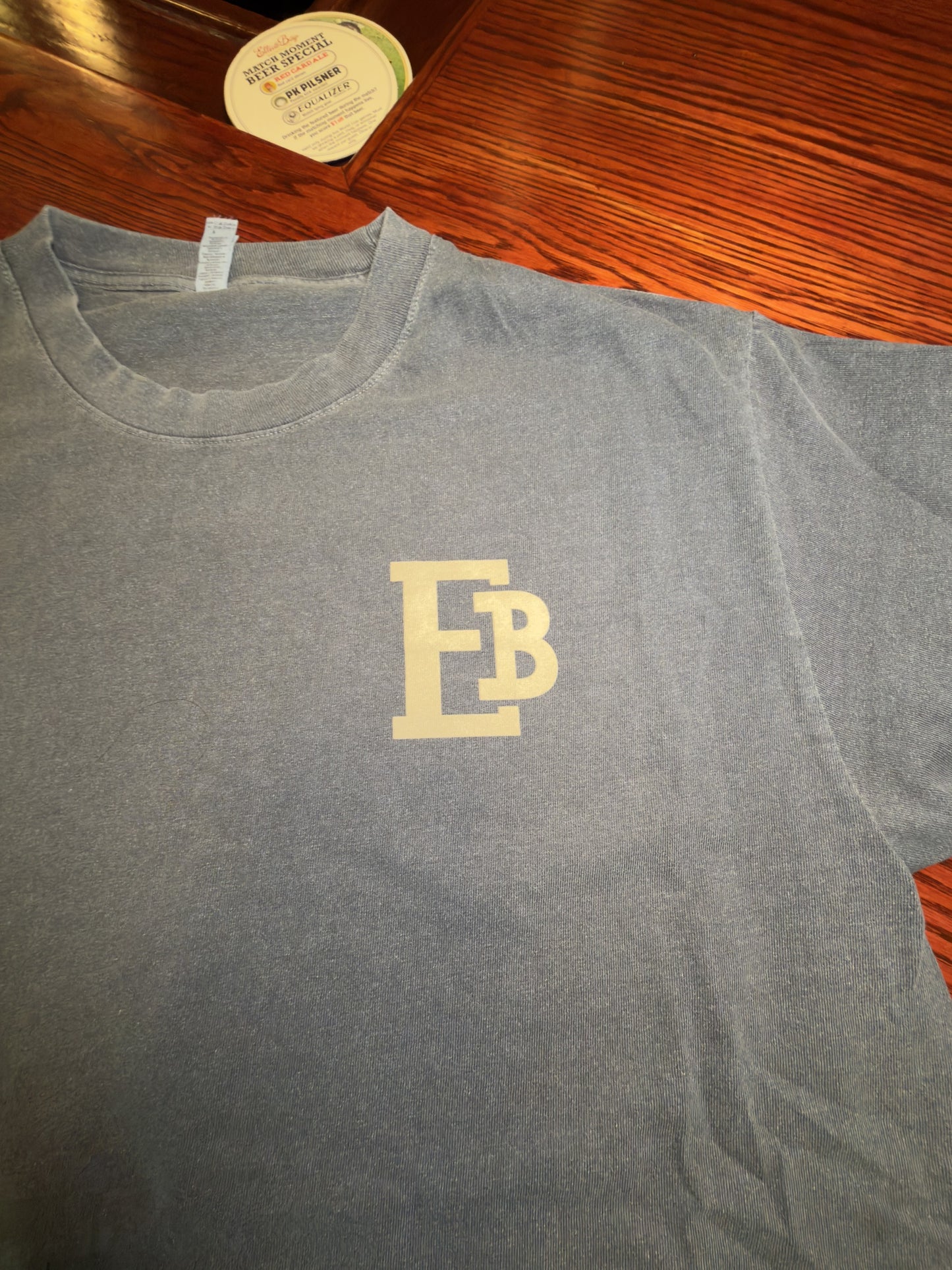 Front view of the Faded Navy Seattle Skyline T-Shirt with small EB chest mark